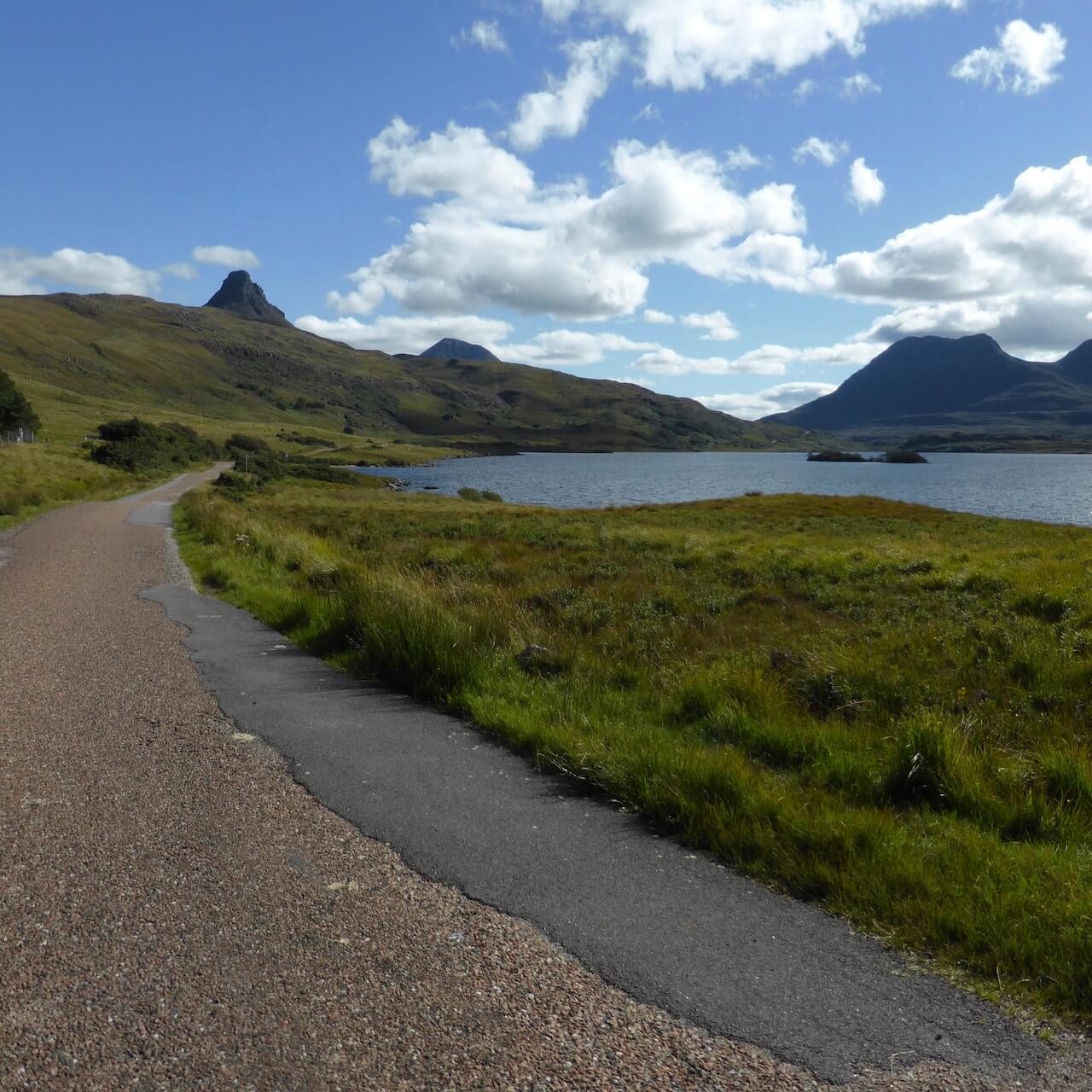 Single track road with Stac Pollaidh in the background