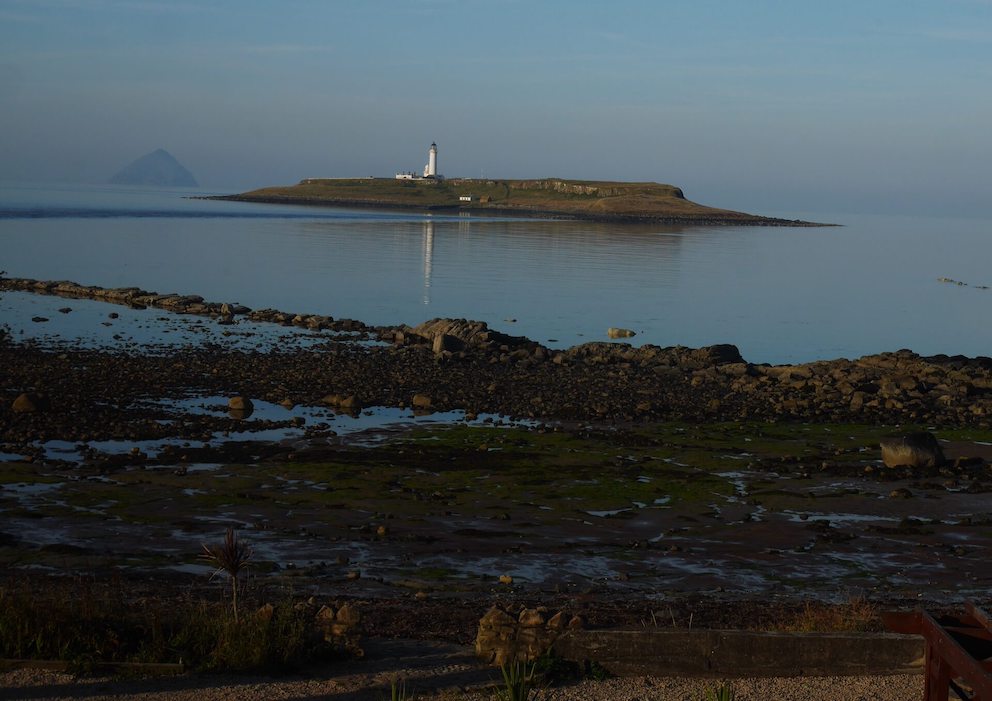 View of Pladda Island overlooking the village of Kildonan, Arran